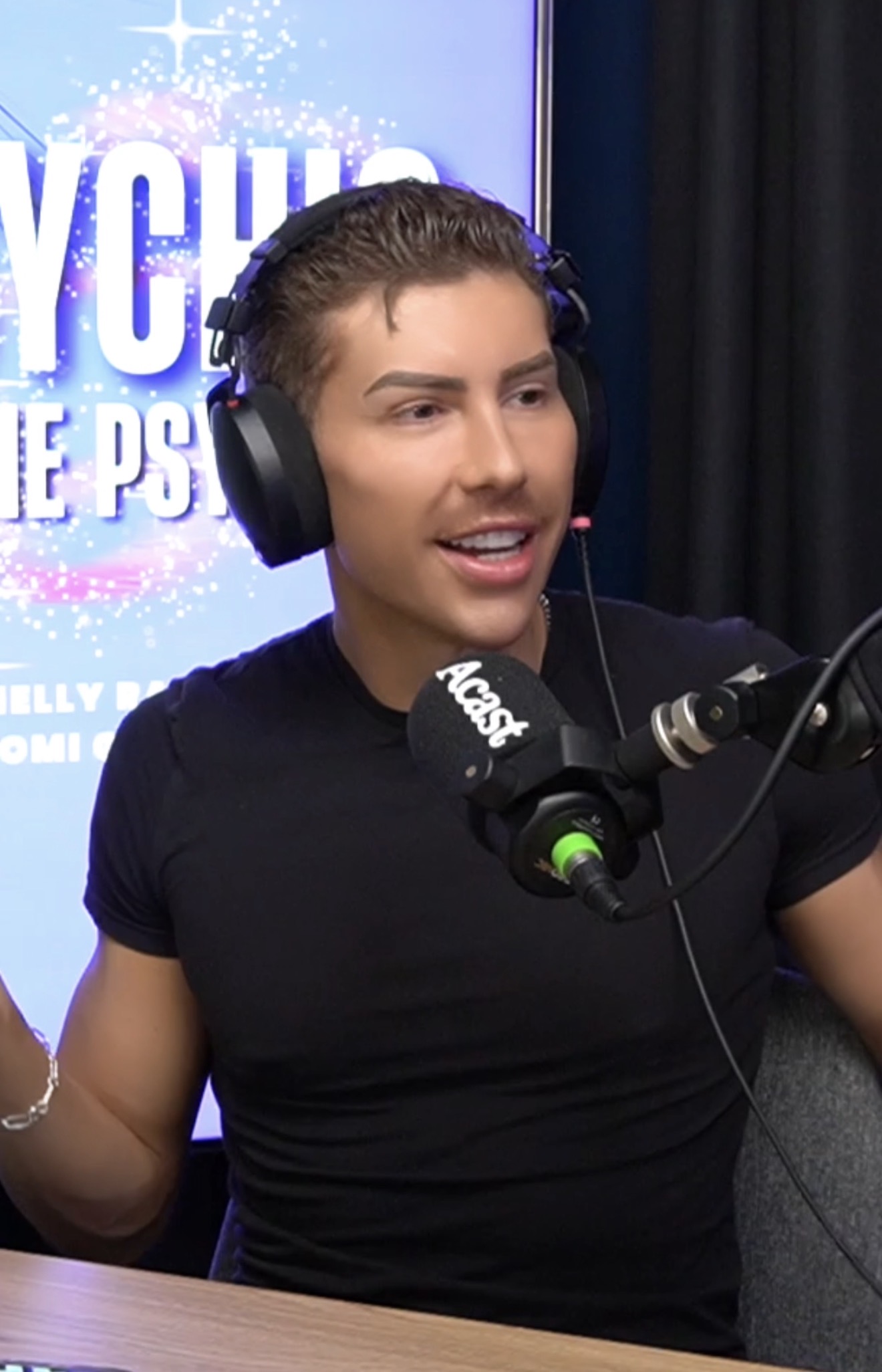 Tomi recording a podcast